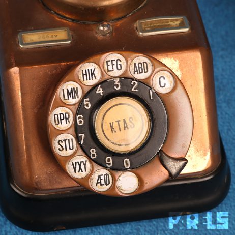 vintage koperen telefoon hoorn bakeliet draaischijf bellen