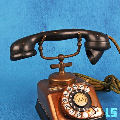 vintage koperen telefoon hoorn bakeliet draaischijf bellen