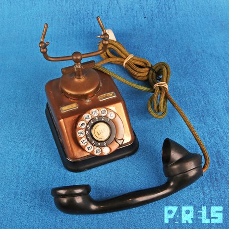 vintage koperen telefoon hoorn bakeliet draaischijf bellen